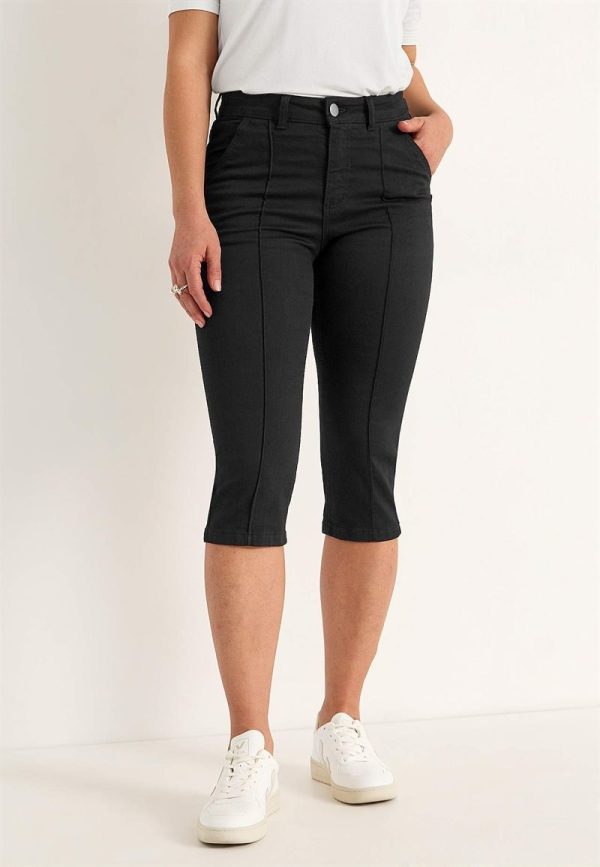 Elastiske crop jeans med syet pressefold